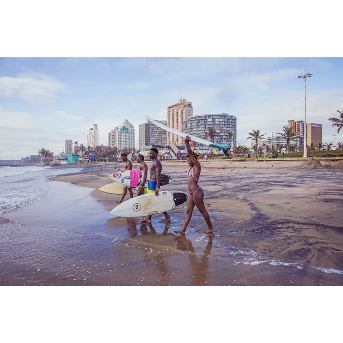Coastal beachDurbanPeople walking with surfboards along Durban beach