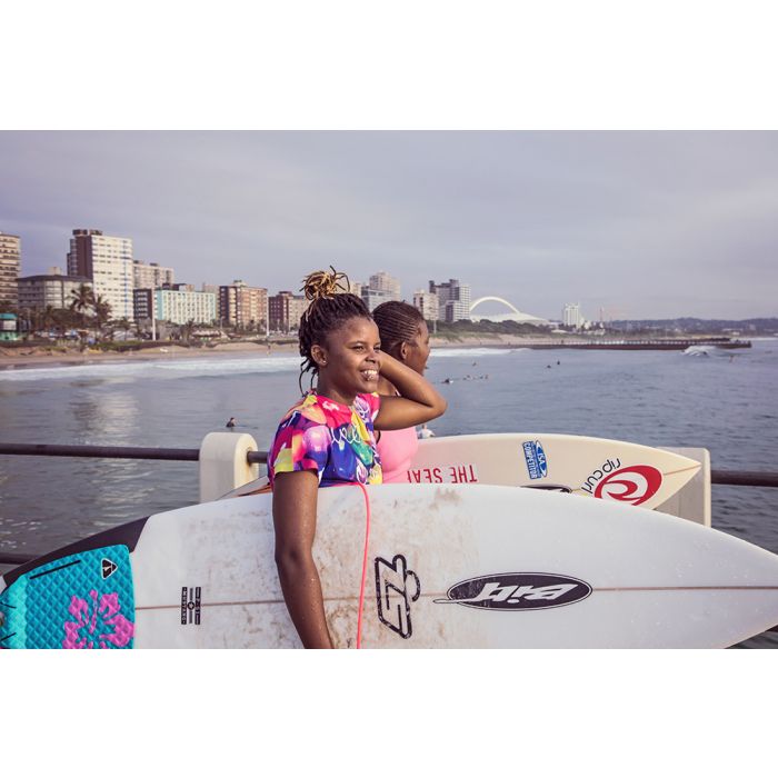 Coastal beachDurbanTwo women holding surfboards at Durban beachfront